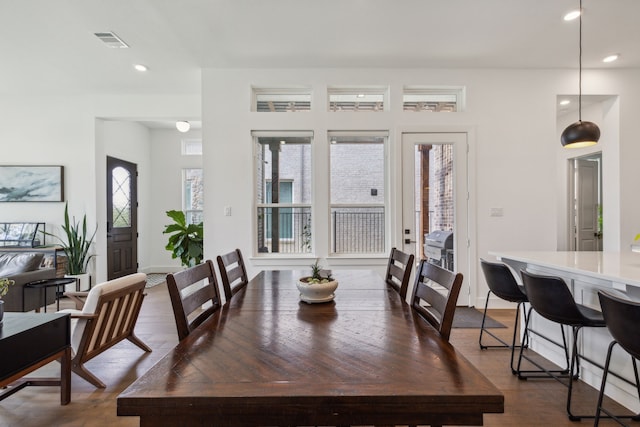 dining space with dark hardwood / wood-style floors