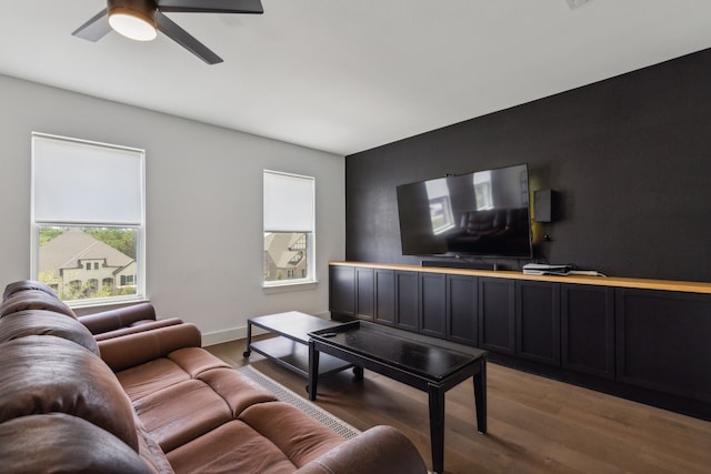 living room featuring hardwood / wood-style flooring and ceiling fan