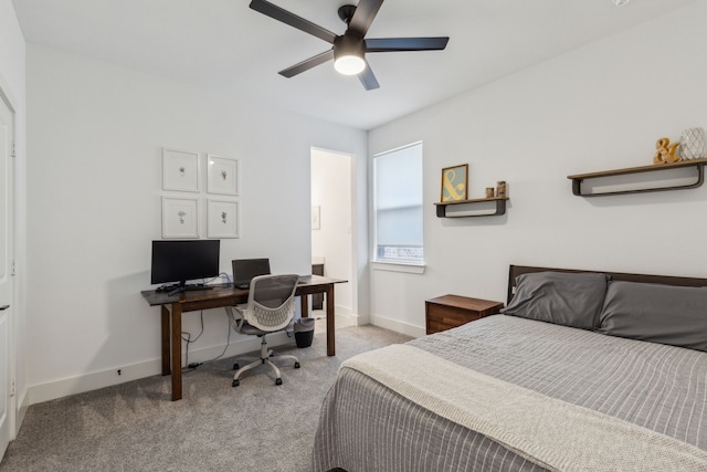 bedroom with ceiling fan and light carpet