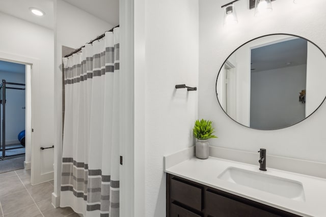 bathroom featuring a shower with curtain, vanity, and tile patterned floors