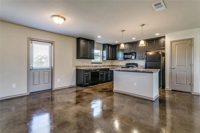 kitchen featuring a kitchen island, black appliances, and hanging light fixtures