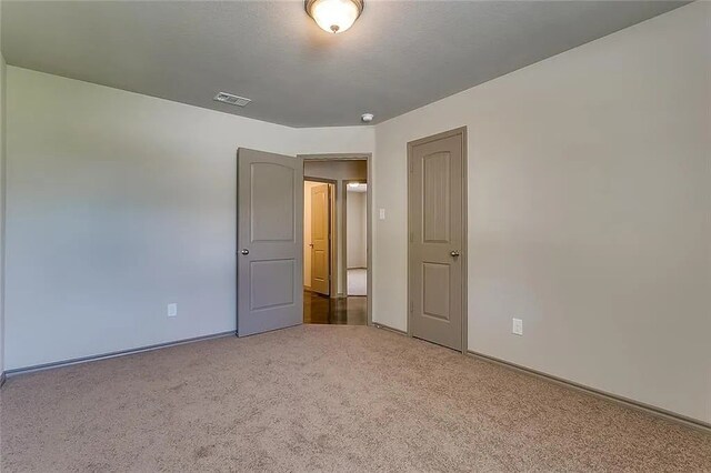 unfurnished bedroom featuring carpet flooring