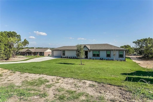 ranch-style home featuring a front lawn and a garage