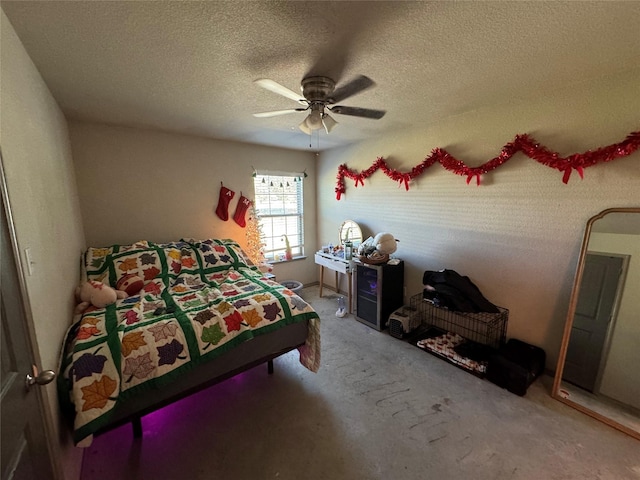 bedroom with a textured ceiling and ceiling fan