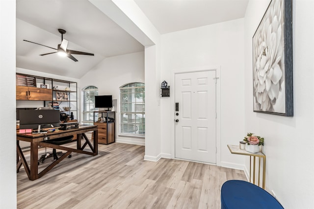 foyer featuring ceiling fan, lofted ceiling, and light hardwood / wood-style flooring