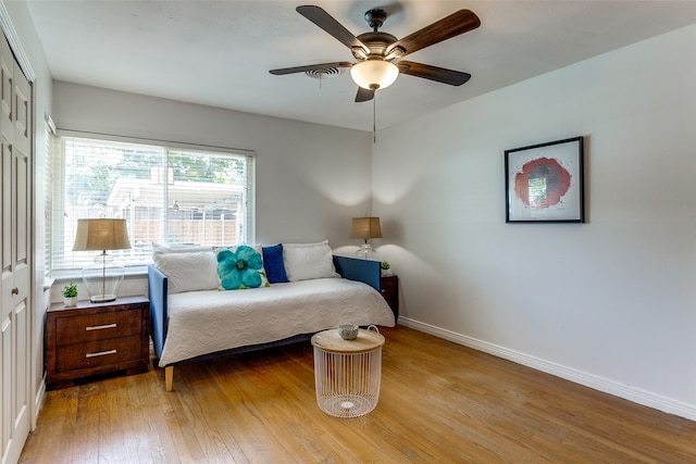 bedroom featuring a closet, ceiling fan, and light hardwood / wood-style floors