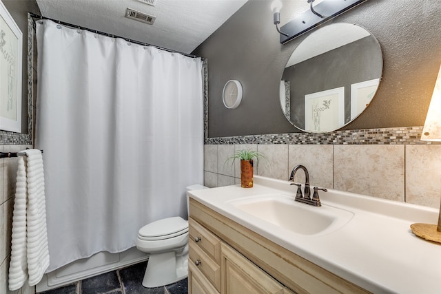 full bathroom featuring tile walls, radiator heating unit, vanity, tile patterned flooring, and toilet