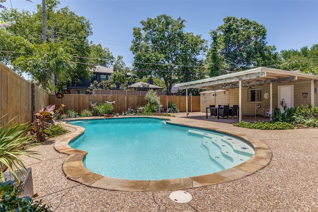 view of swimming pool with a patio area