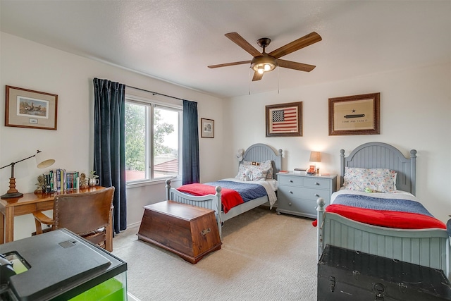 bedroom featuring ceiling fan and light carpet