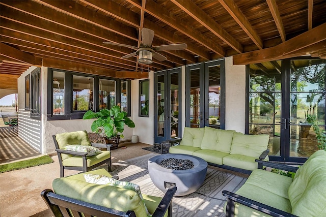 sunroom with a wealth of natural light and ceiling fan