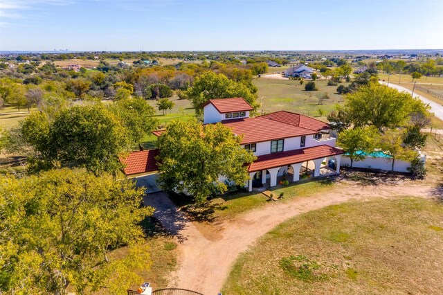 birds eye view of property featuring a rural view