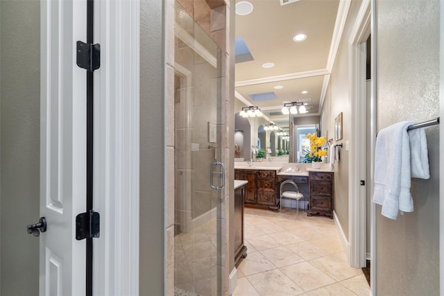 bathroom featuring a shower with door, vanity, tile patterned floors, and crown molding