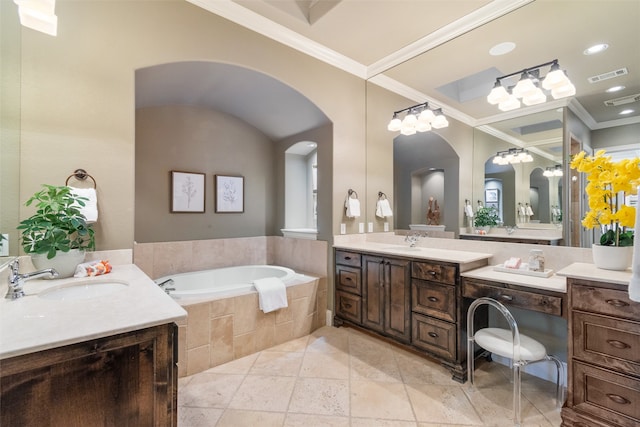 bathroom with tiled tub, vanity, tile patterned floors, and crown molding