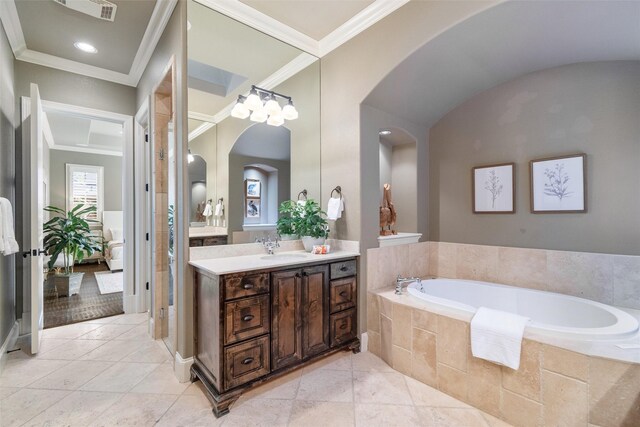 bathroom with vanity, tiled bath, tile patterned flooring, and crown molding