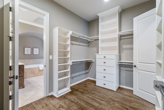 spacious closet featuring tile patterned flooring