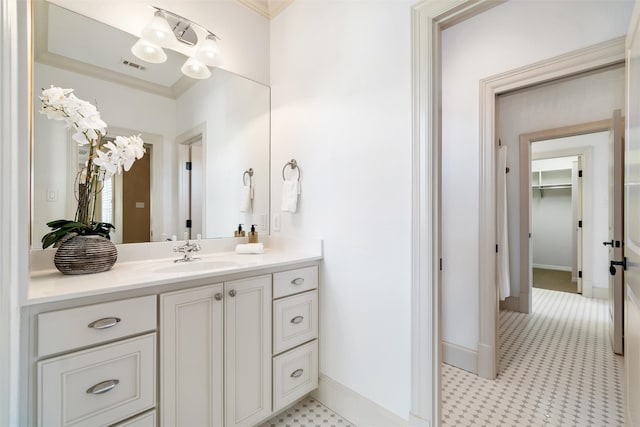 bathroom featuring vanity and crown molding