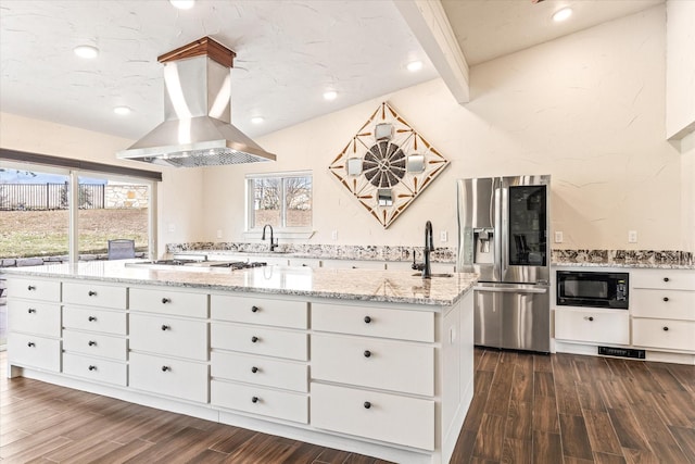 kitchen with island exhaust hood, dark hardwood / wood-style flooring, white cabinets, and stainless steel appliances