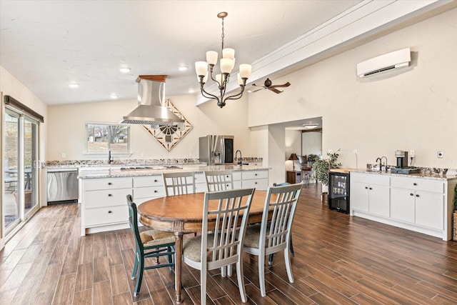 dining area with lofted ceiling, a wall unit AC, beverage cooler, and dark wood-type flooring