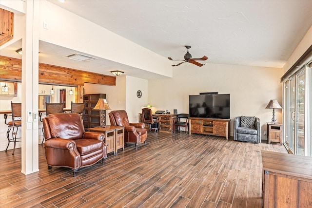 living room with ceiling fan and dark hardwood / wood-style flooring