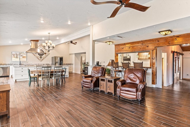 living room with dark hardwood / wood-style flooring, ceiling fan with notable chandelier, and lofted ceiling