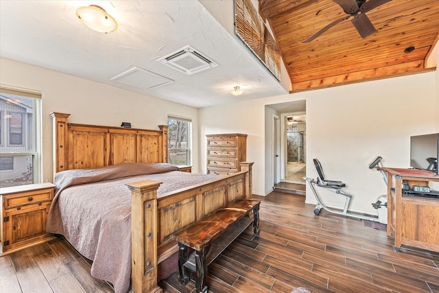 bedroom featuring dark wood-type flooring and lofted ceiling