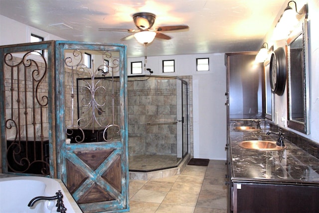 bathroom featuring tile patterned floors, vanity, separate shower and tub, and ceiling fan