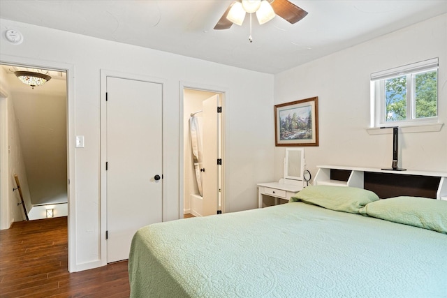 bedroom featuring ensuite bath, dark hardwood / wood-style floors, and ceiling fan