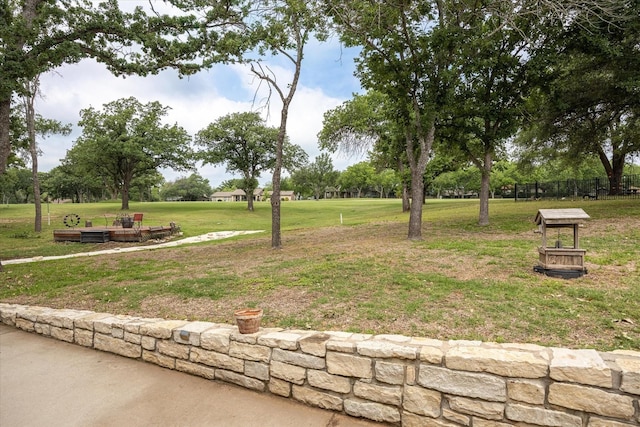 view of property's community featuring a lawn