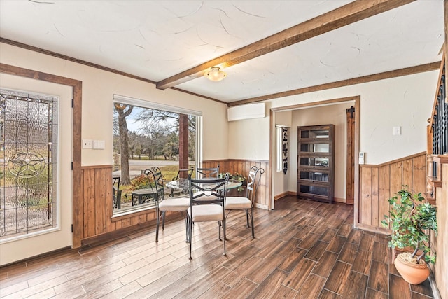 dining room with beamed ceiling, dark hardwood / wood-style floors, wood walls, and a wall unit AC