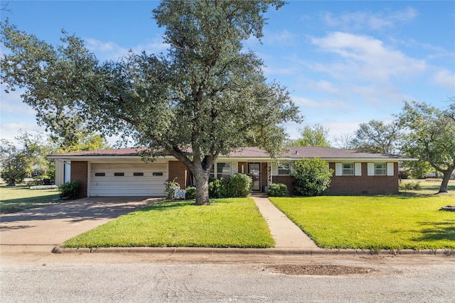 ranch-style home with a front lawn and a garage