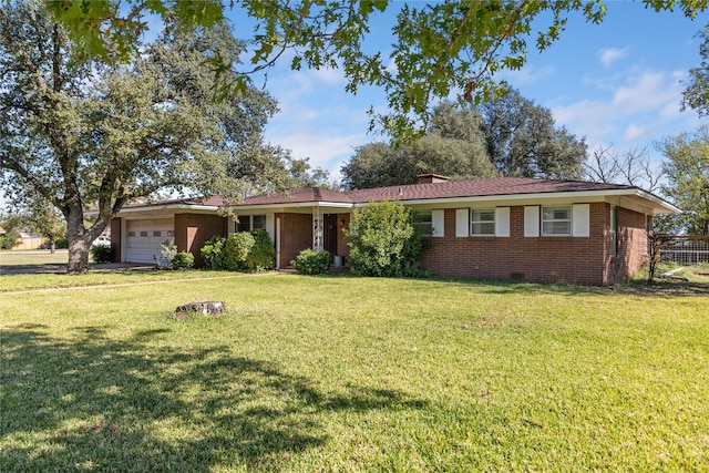 ranch-style home with a garage and a front yard