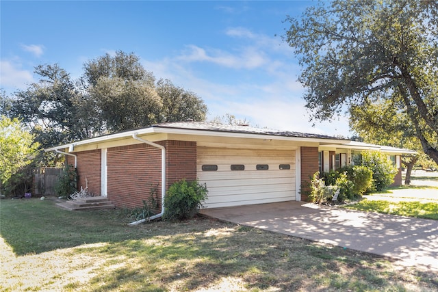 view of front facade with a garage and a front lawn