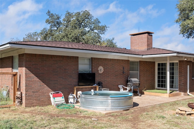 rear view of house featuring a patio area