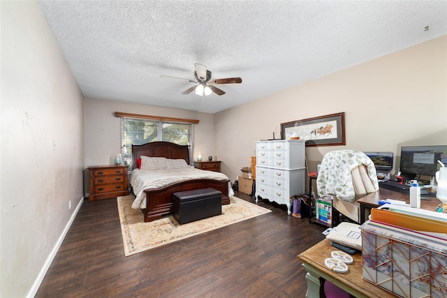 bedroom with a textured ceiling, dark hardwood / wood-style floors, and ceiling fan