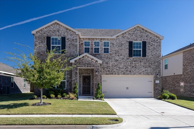 view of front of house with a front yard, a garage, and central air condition unit