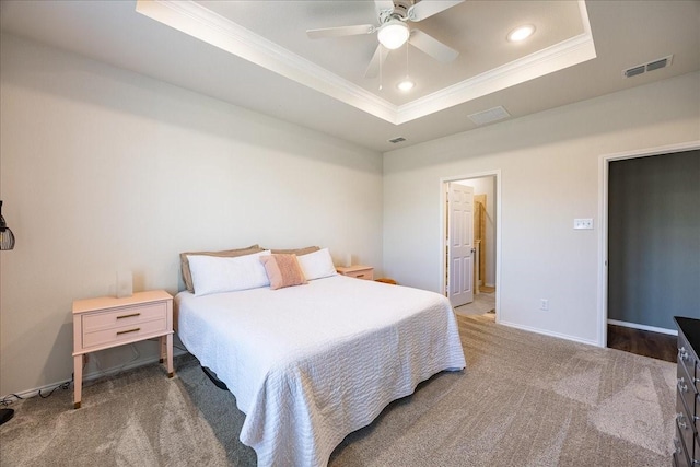 carpeted bedroom with crown molding, a raised ceiling, baseboards, recessed lighting, and ceiling fan