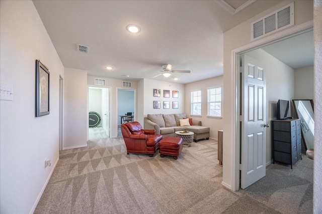 living room featuring baseboards, visible vents, and carpet flooring