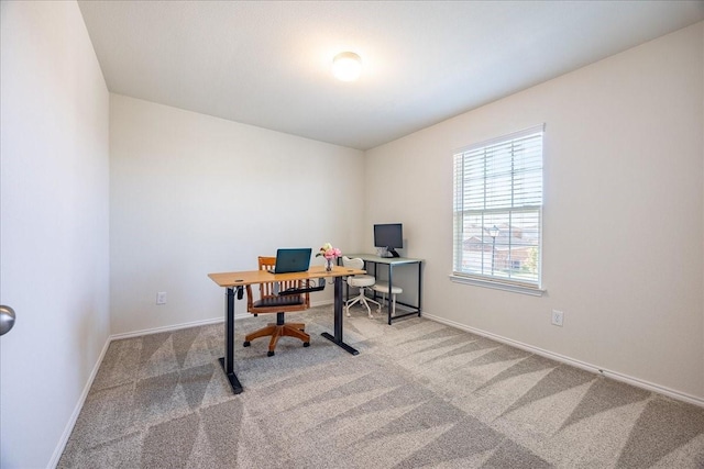 carpeted office with baseboards