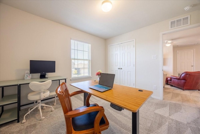 carpeted office space featuring baseboards