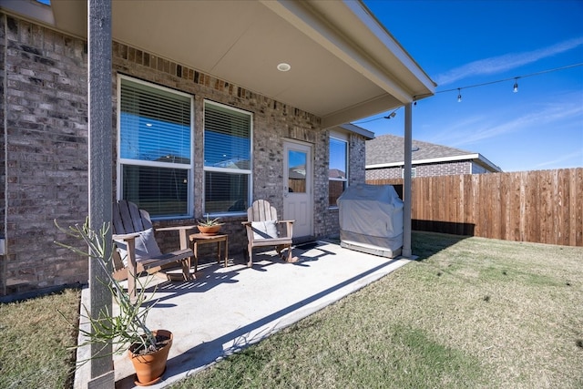 view of patio / terrace with fence and area for grilling