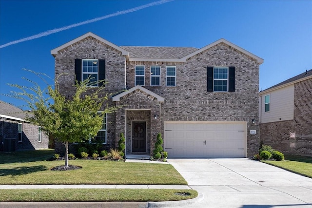 traditional-style house featuring concrete driveway, cooling unit, a front yard, a garage, and brick siding
