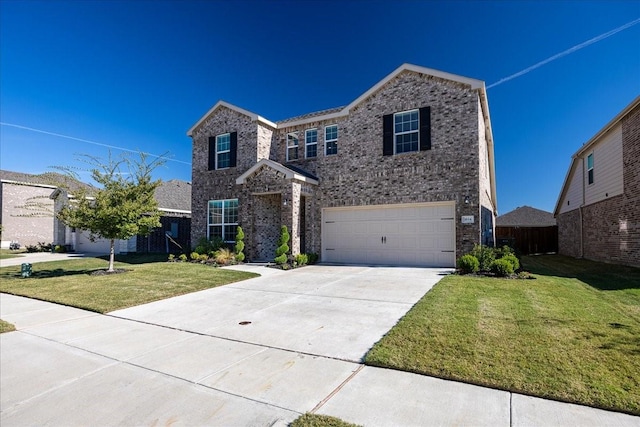 traditional home featuring brick siding, an attached garage, a front yard, and driveway