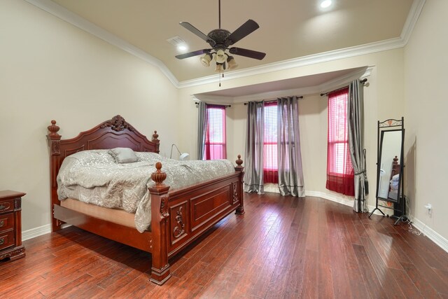 bedroom with dark hardwood / wood-style flooring, ceiling fan, and crown molding