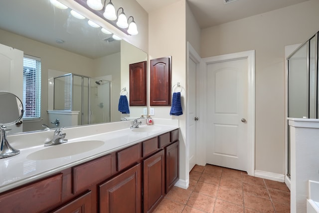 bathroom featuring walk in shower, vanity, and tile patterned floors