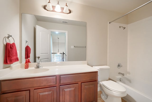 full bathroom featuring toilet, vanity, and tiled shower / bath