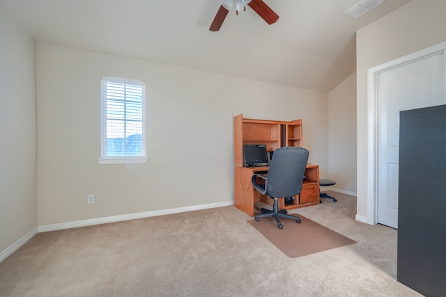 carpeted office space with ceiling fan