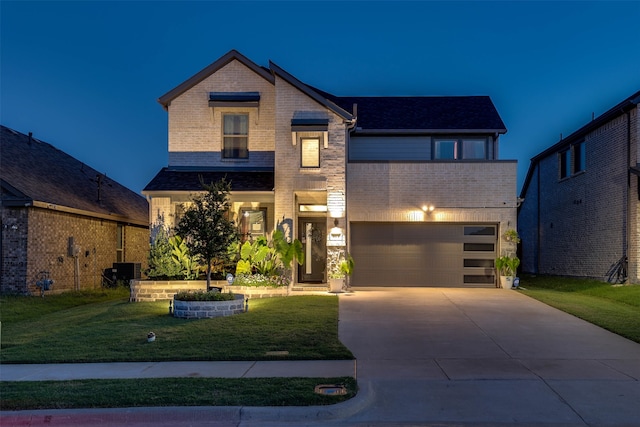 view of front of home with a garage and a front yard