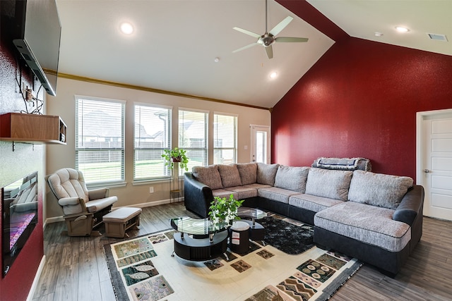 living room featuring high vaulted ceiling, dark wood-type flooring, ceiling fan, and crown molding