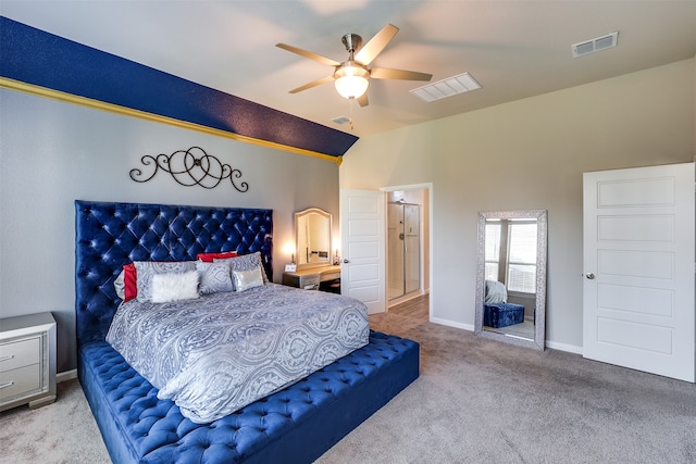 bedroom with ceiling fan, lofted ceiling, and light colored carpet