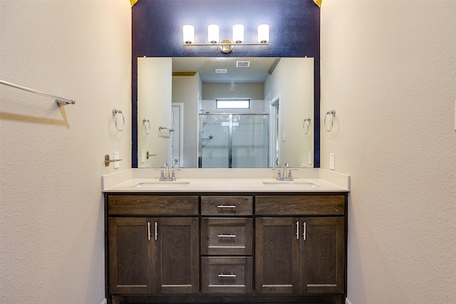 613 Hazeltine Rd, Red Oak, TX 75154 - full bath with double vanity, a stall shower, and a textured wall